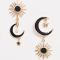 Goudkleurige oorbellen met de zon, de maan en sterren