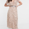 Champagnekleurige midi-jurk met oversized pailletten
