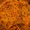 Des spaghettis avec des saucisses au curry