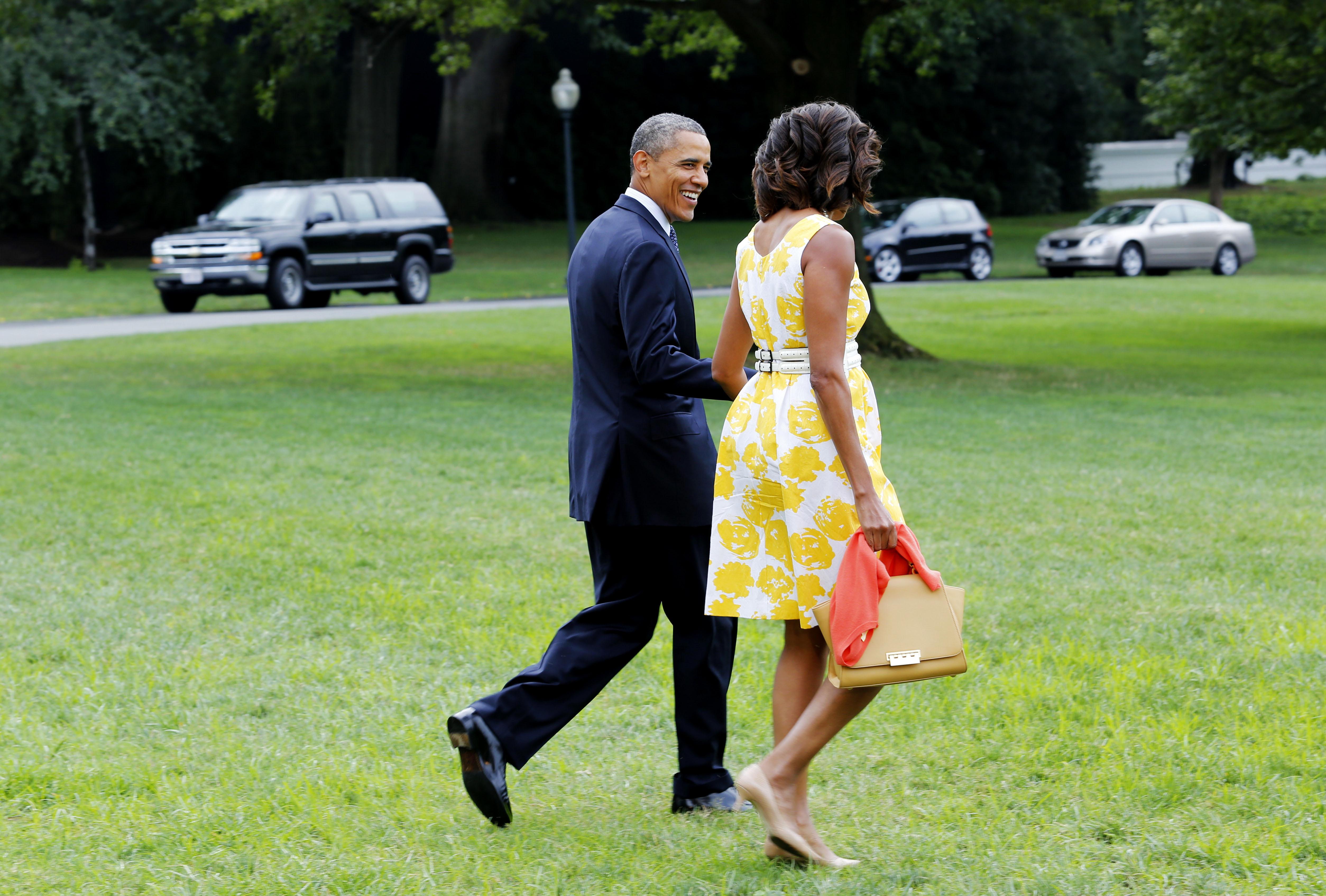 United States President Barack Obama and first lady Michelle Obama depart the White House in Washington, D.C. en route to Joint Base Andrews for a trip to Orlando, Florida where they will address injured veterans at the Disabled American Veterans National Convention on Saturday, August 10, 2013. In the afternoon, they will depart Orlando for Martha's Vineyard, Massachusetts. Credit: Aude Guerrucci / Pool via CNP Reporters / DPA