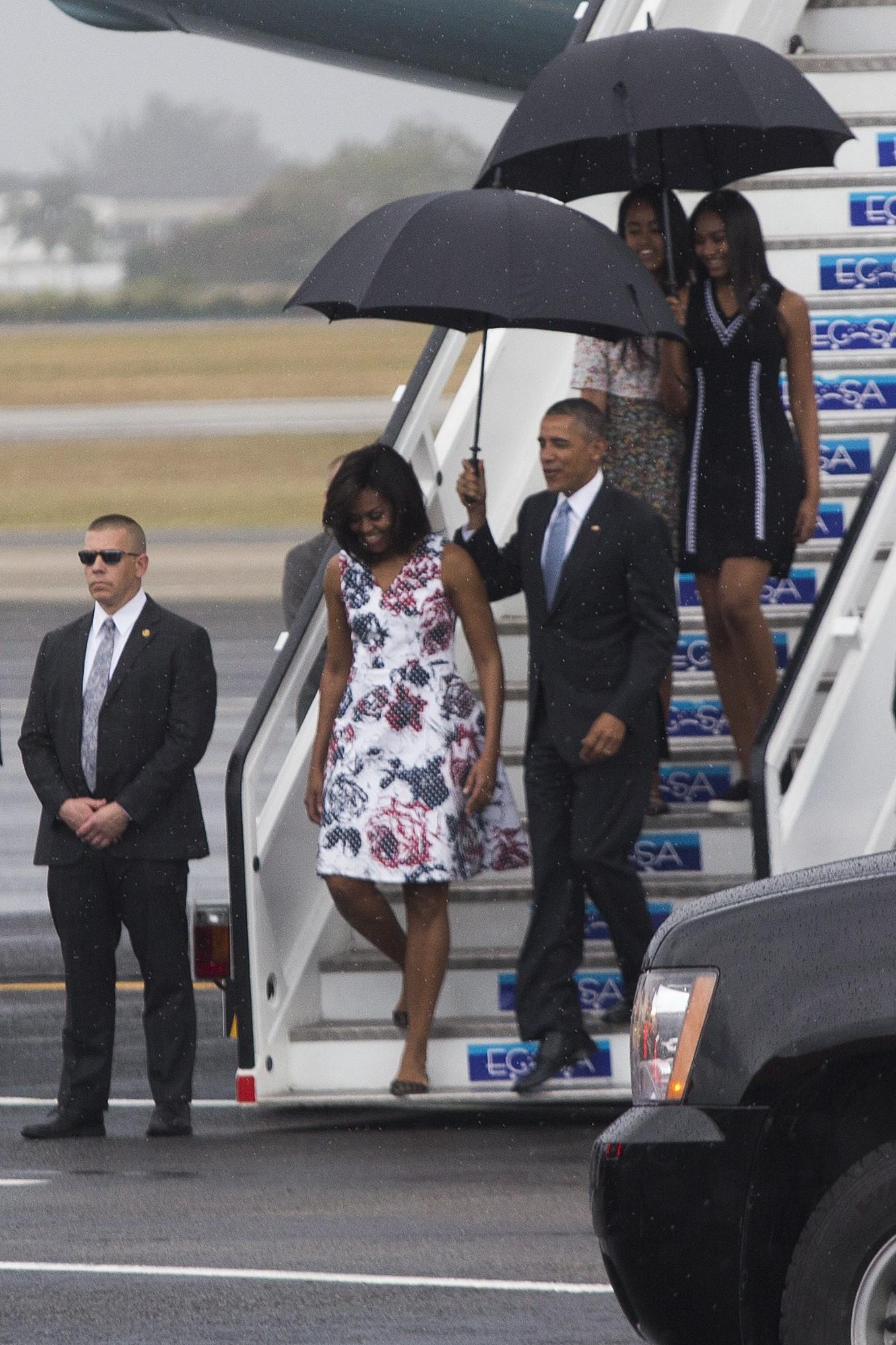 HAVANA, CUBA - MARCH 20: US President Barack Obama (3rd L) and his wife Michelle Obama (2nd L) leave official plane "Air Force One" as it landed Jose Marti İnternational Airport during the first visit to Cuba by a U.S. president in nearly 90 years, in Havana, Cuba on March 20, 2016. US President Obama were welcomed by Cuban Foreign Minister Bruno Rodriguez Padilla at the airport. Enrique Castro Sanchez / Anadolu Agency Reporters / Abaca