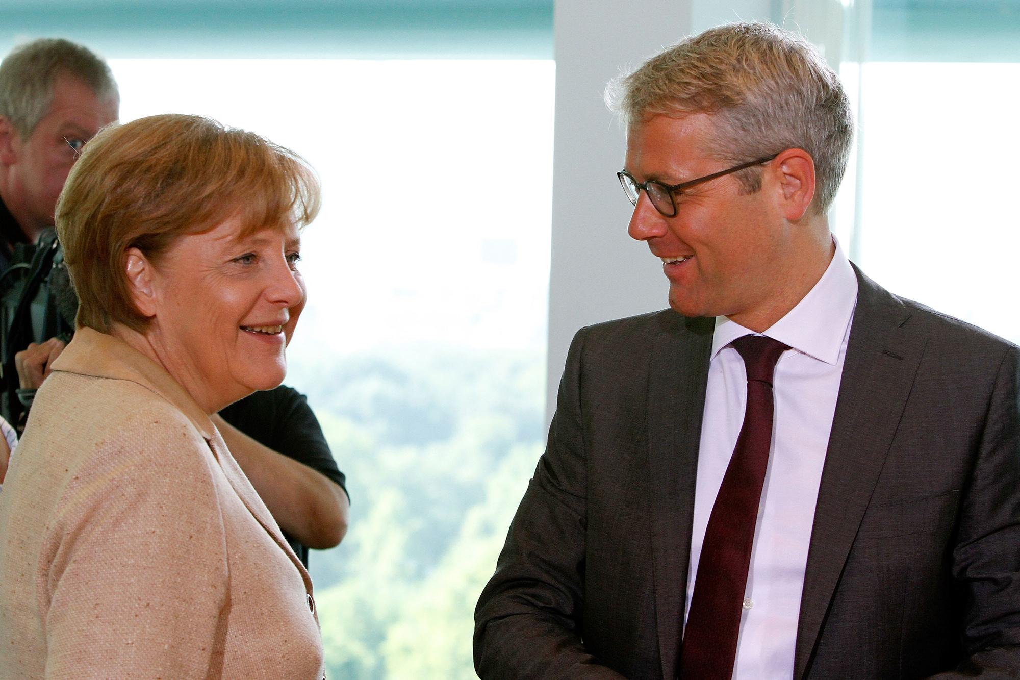 Angela Merkel en Norbert Röttgen in 2011.