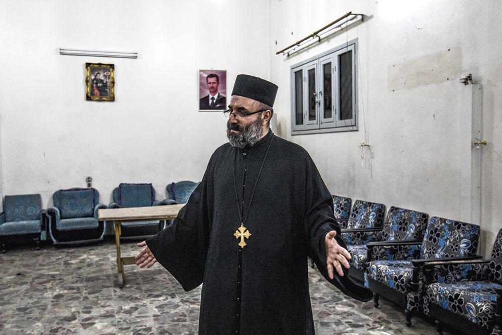 'Zelfs de christenen die zich de afgelopen jaren tegen Assad hebben gekeerd,' zegt priester Saliba Abdallah, 'zijn blij dat hij terug is.'