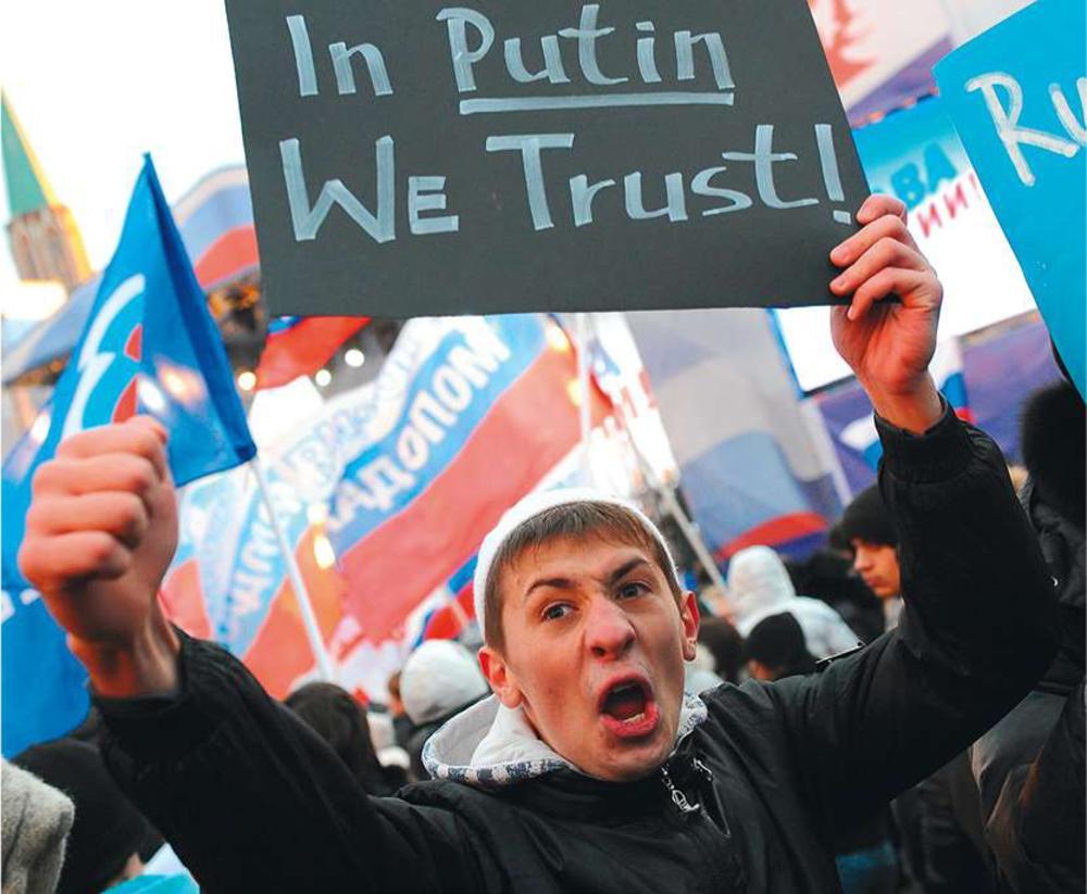 Moskou, 12 december 2011. Een jonge betoger steekt een bordje omhoog met daarop de slogan 