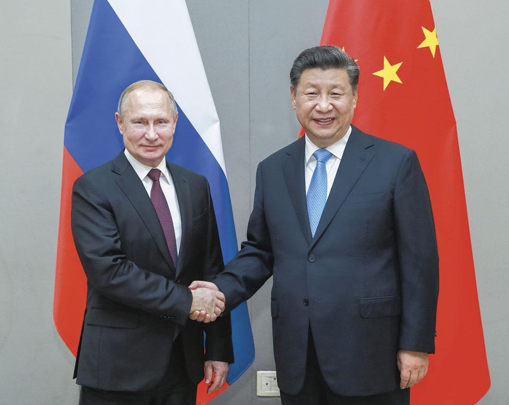 Vladimir Poetin en Xi Jinping 'Bluffen over je eigen slagkracht is een essentieel onderdeel van iedere wapenwedloop.'