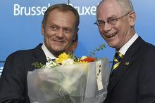De kersverse Europese president Donald Tusk (links) naast de uittredende Herman Van Rompuy (rechts)