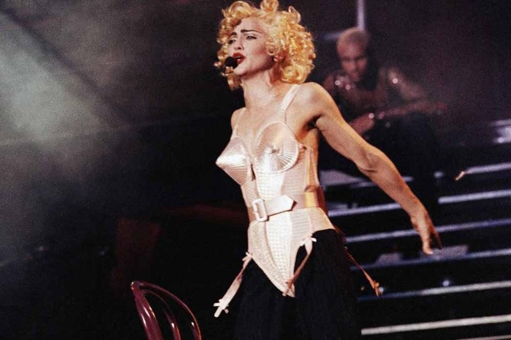 Pop star Madonna goes into a frenzy before a full Vicente Calderon Stadium in Madrid on July 27, 1990 during the first of three performances in Spain. (AP Photo/Jimmy Rubio)