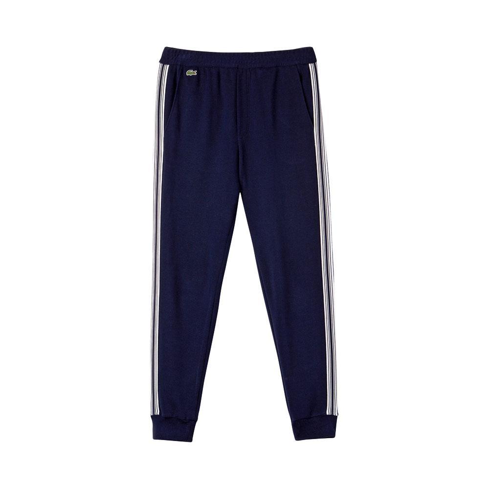 Pantalon en coton et veste de jogging en taffetas, Lacoste, 165 et 215 euros