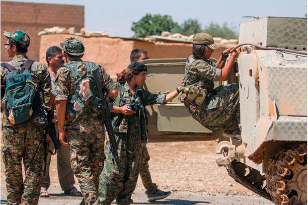 MILICE KURDE à Raqqa, en juin 2015. Pour eux, pas d'armes belges.