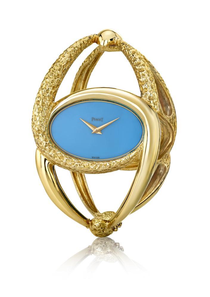 Een turquoise uurwerk van Piaget.