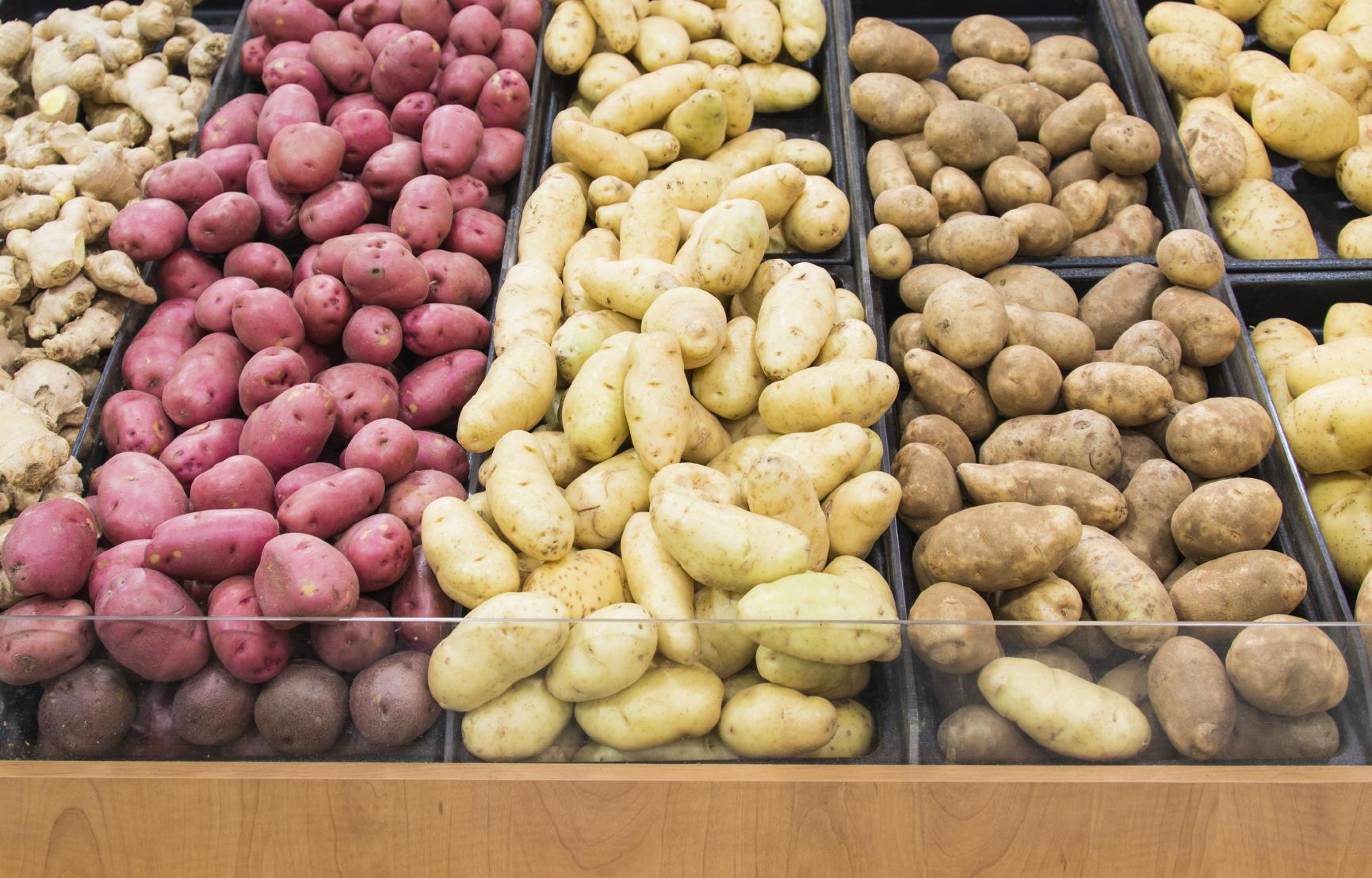 Different colors potatoes in a grocery store