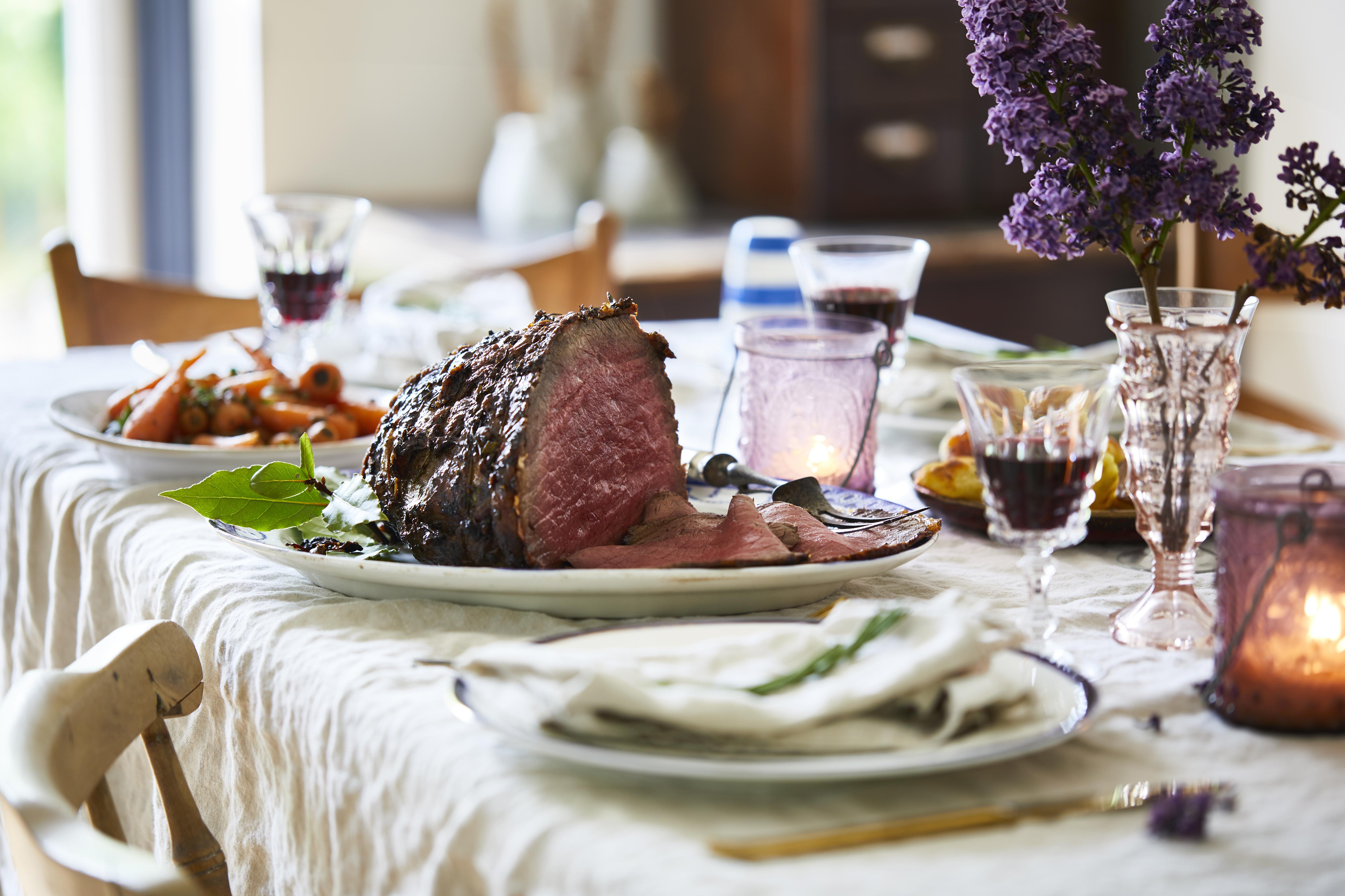 Sunday roast on dining table, ready to serve