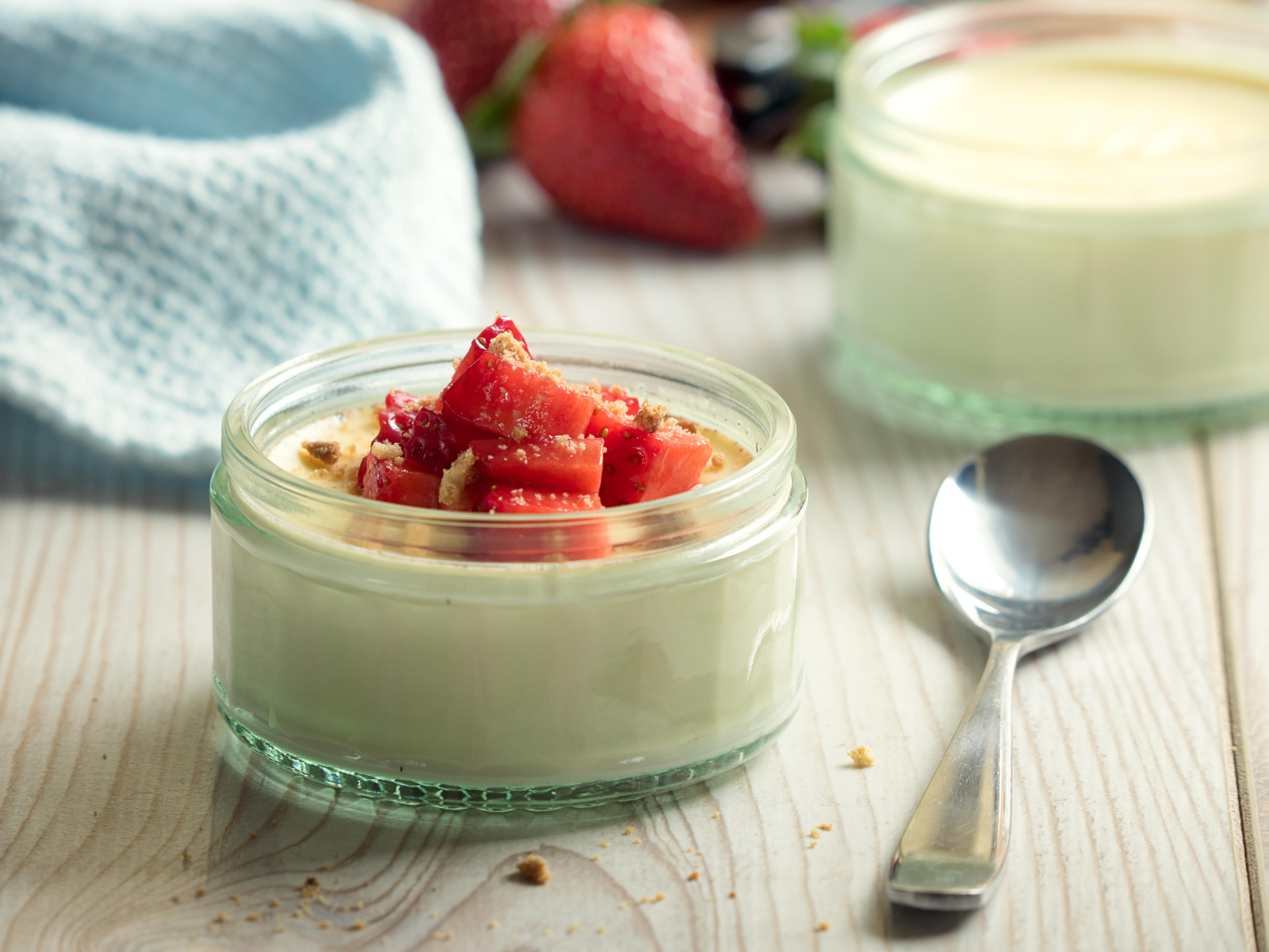 creamy Vanilla panna cotta served with freshness halved strawberries