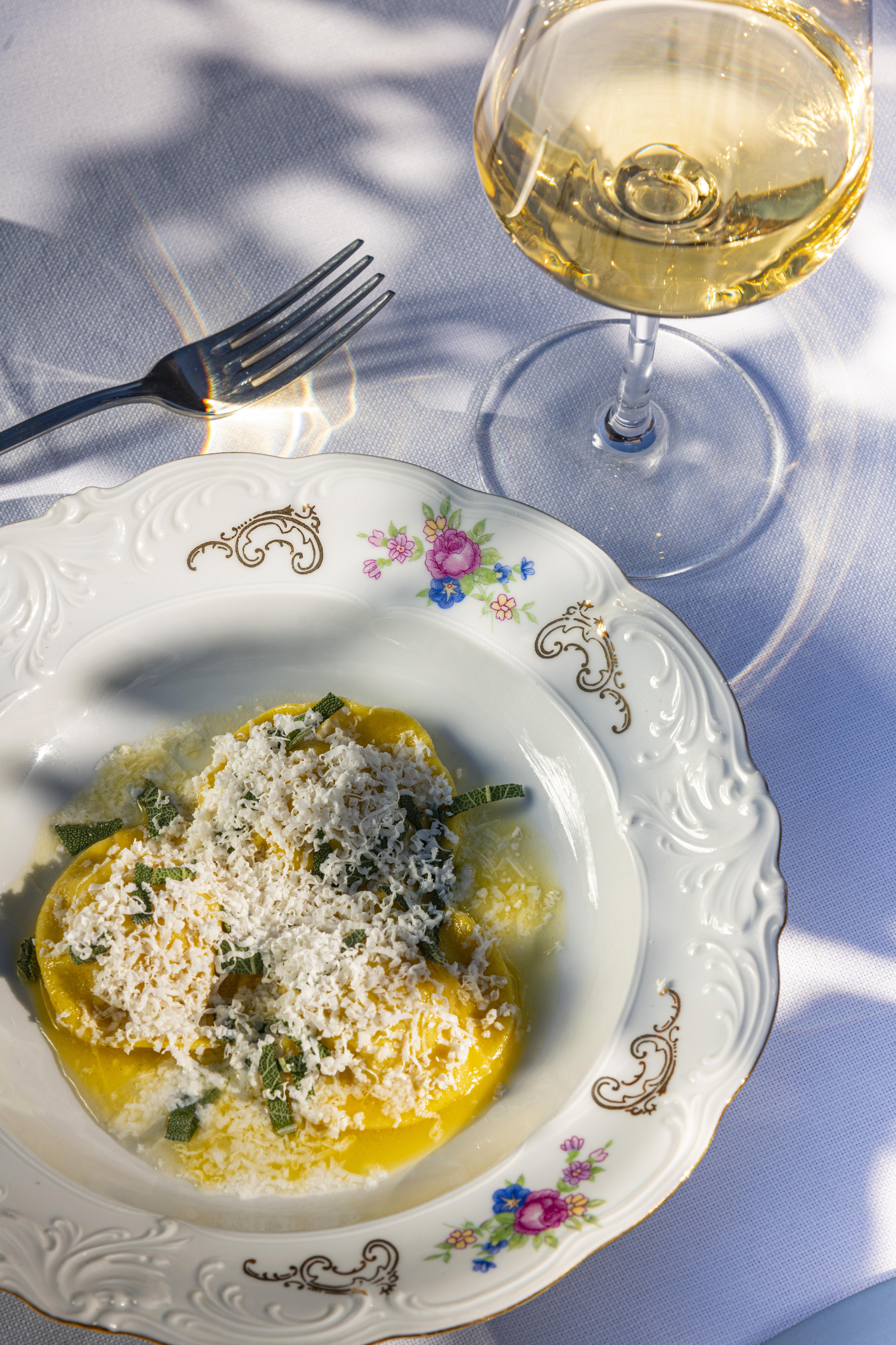 potato tortelli and white wine glass