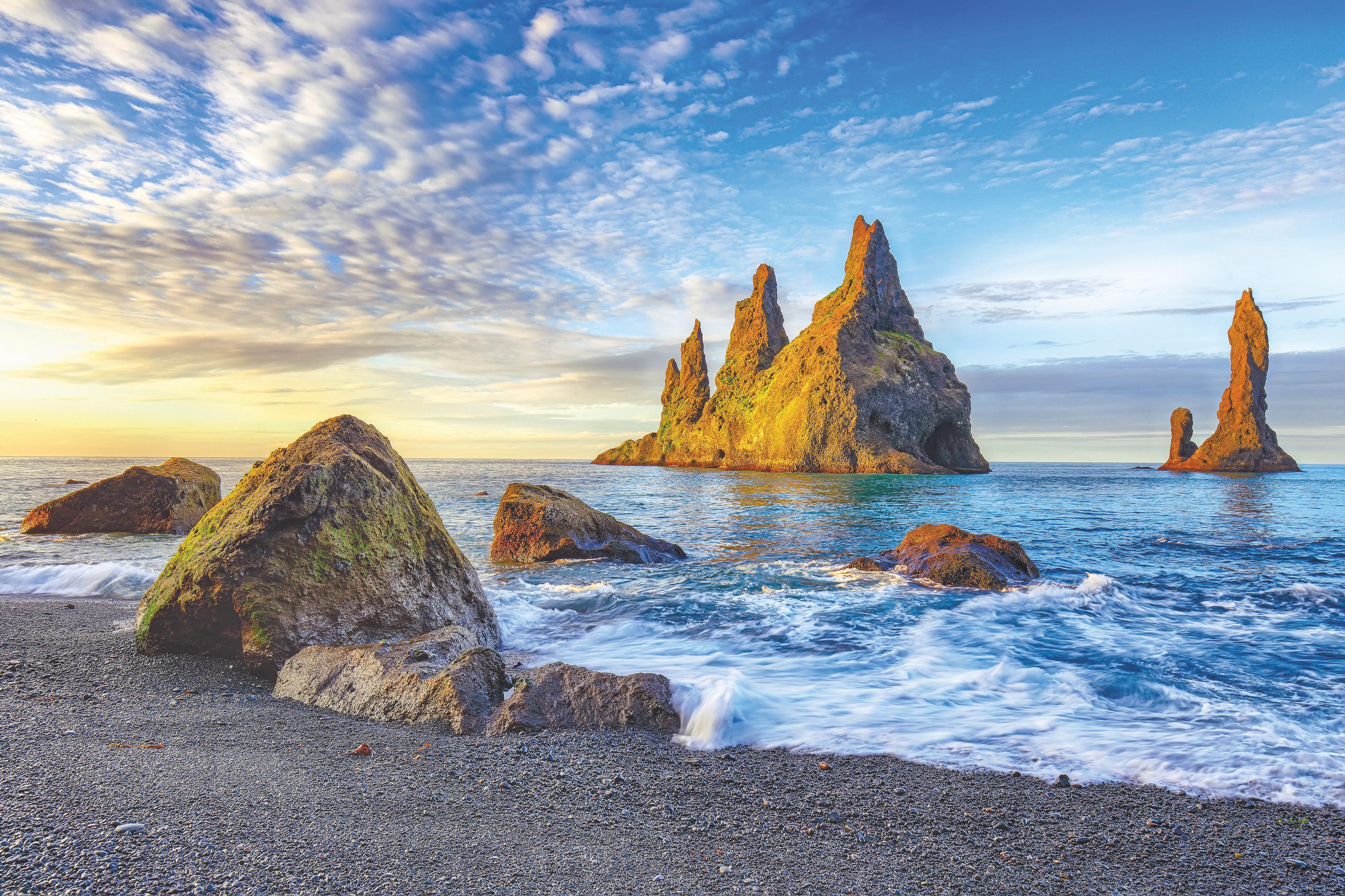 Incredible view of rock formations Troll Toes on Black beach Reynisfjara near the village of Vik."nLocation: Reynisfjara Beach, Vik Village, Iceland (Sudurland), Europe