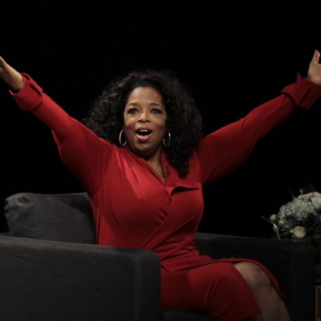 Oprah Winfrey acknowledges the audience after she came to the stage for an interview with Ball State University alumnus David Letterman, host of CBS's "Late Show," at Ball State University in Muncie, Ind., Monday, Nov. 26, 2012. The conversation is part of the David Letterman Distinguished Professional Lecture and Workshop Series. (AP Photo/Michael Conroy) ORG XMIT: INMC105 ORG XMIT: POS1211261644515222