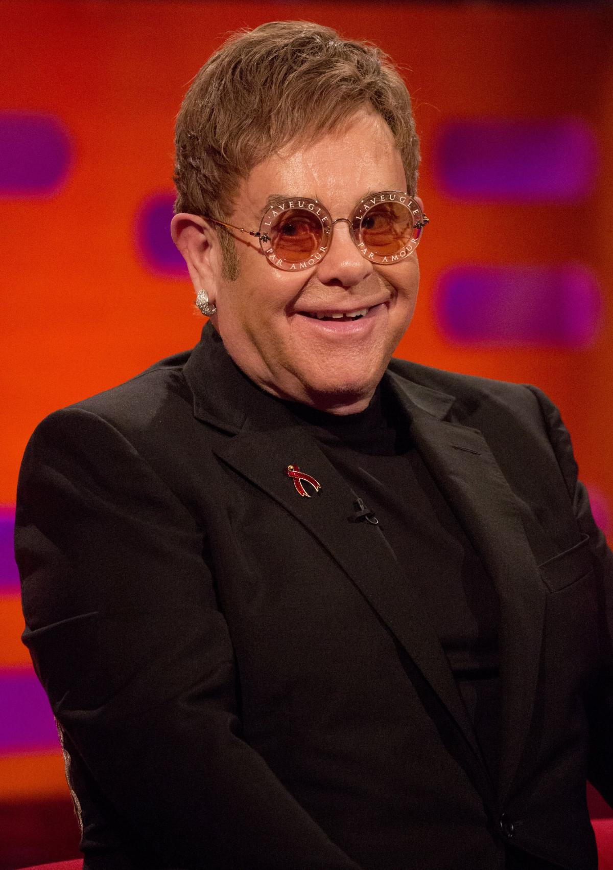 Reginald Kenneth Dwight alias Elton John