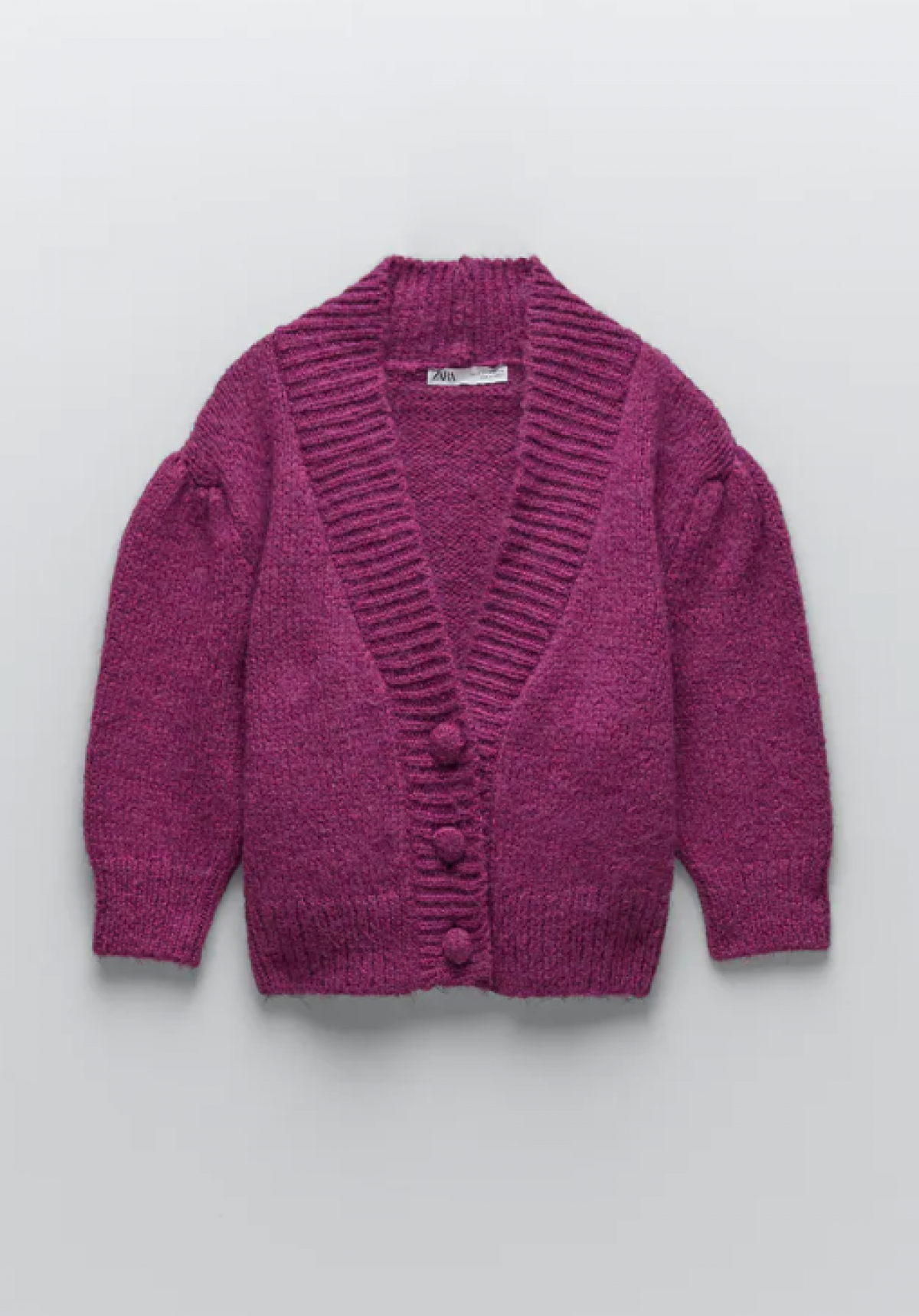 Le cardigan en maille mauve