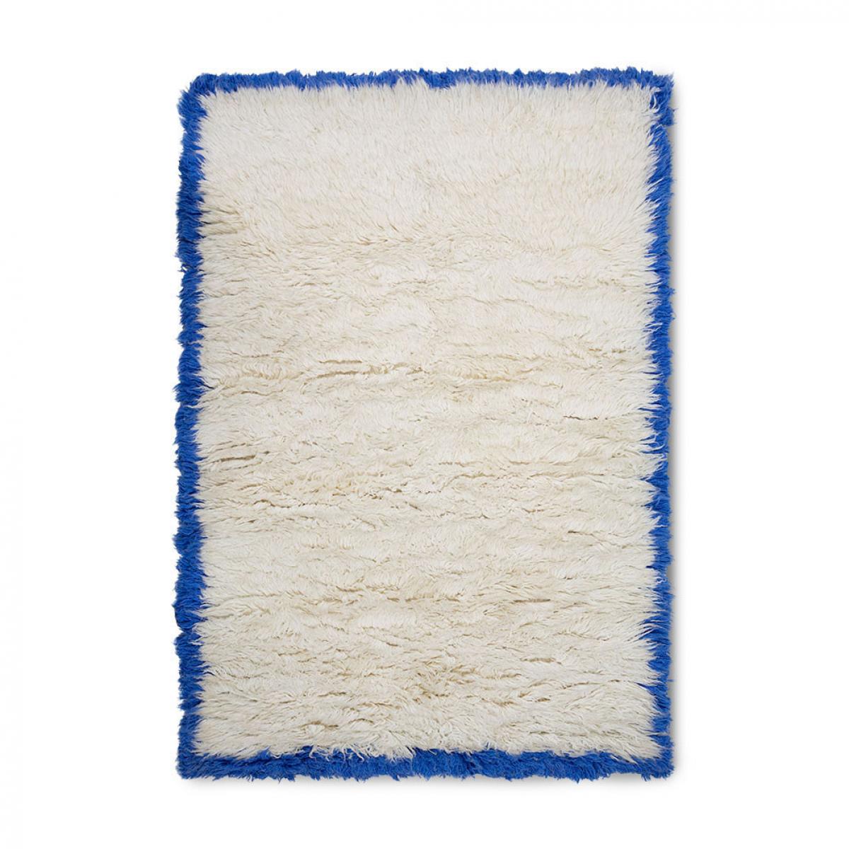 Fluffy tapijt met blauwe rand