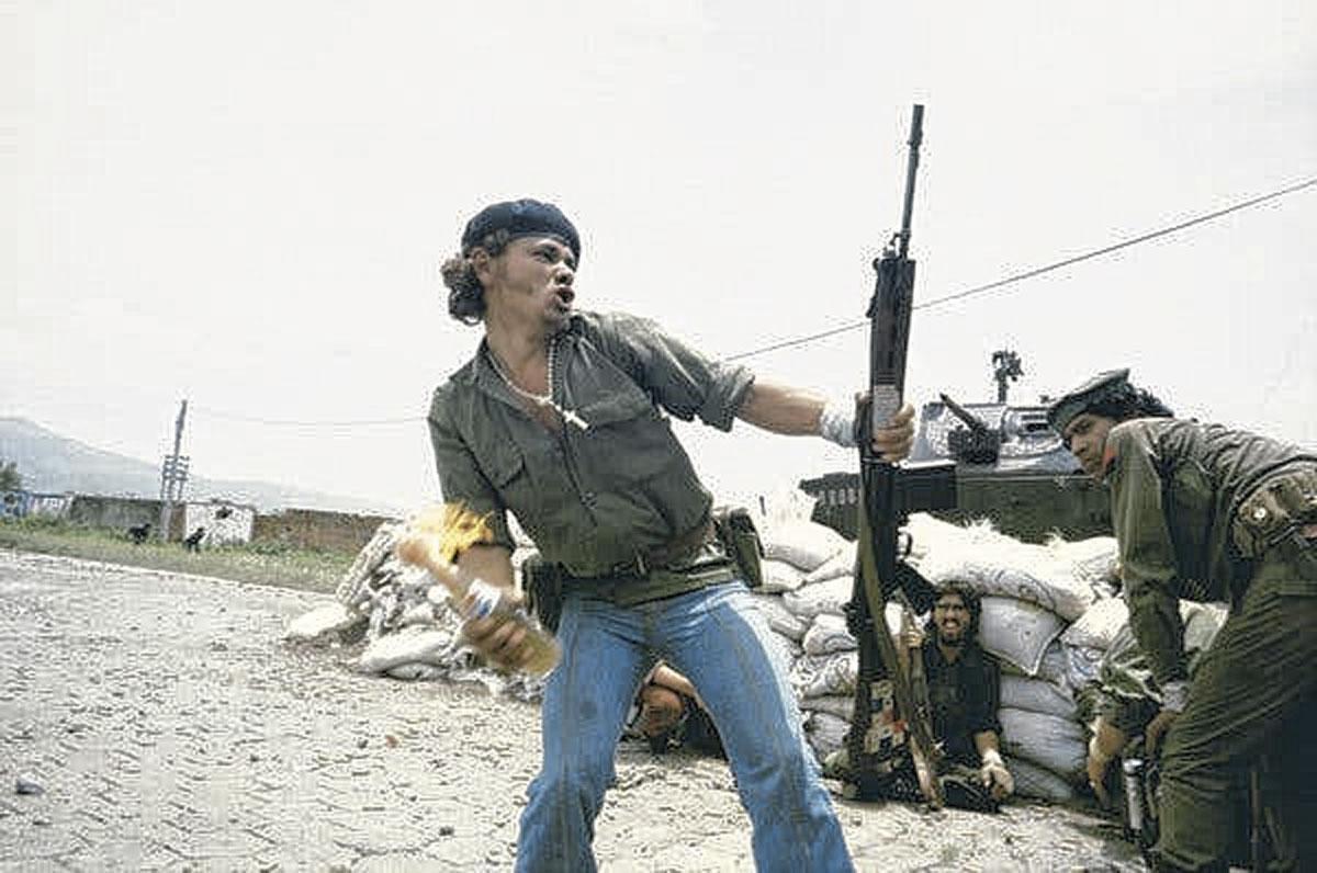 Sandinistas at the Walls of the National Guard Headquarters, ‘Molotov Man’, Susan Meiselas, Estelí, Nicaragua, 1979