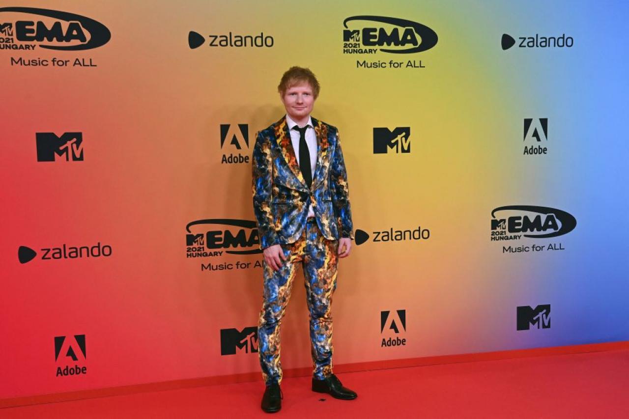 English singer-songwriter Ed Sheeran poses on the red carpet as he arrives for the MTV Europe Music Awards at the Laszlo Papp Budapest Sports Arena in Budapest, Hungary on November 14, 2021. (Photo by Attila KISBENEDEK / AFP) (Photo by ATTILA KISBENEDEK/AFP via Getty Images)
