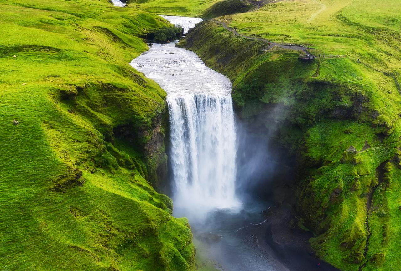 Aerial view on the Skogafoss waterfall in Iceland. Landscape from air. Famous place in Iceland. Travel - image