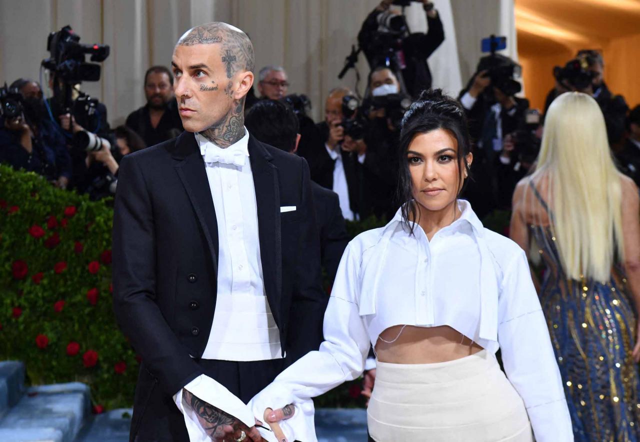 US socialite Kourtney Kardashian and US musician Travis Barker arrive for the 2022 Met Gala at the Metropolitan Museum of Art on May 2, 2022, in New York. - The Gala raises money for the Metropolitan Museum of Art's Costume Institute. The Gala's 2022 theme is "In America: An Anthology of Fashion". (Photo by ANGELA  WEISS / AFP)
