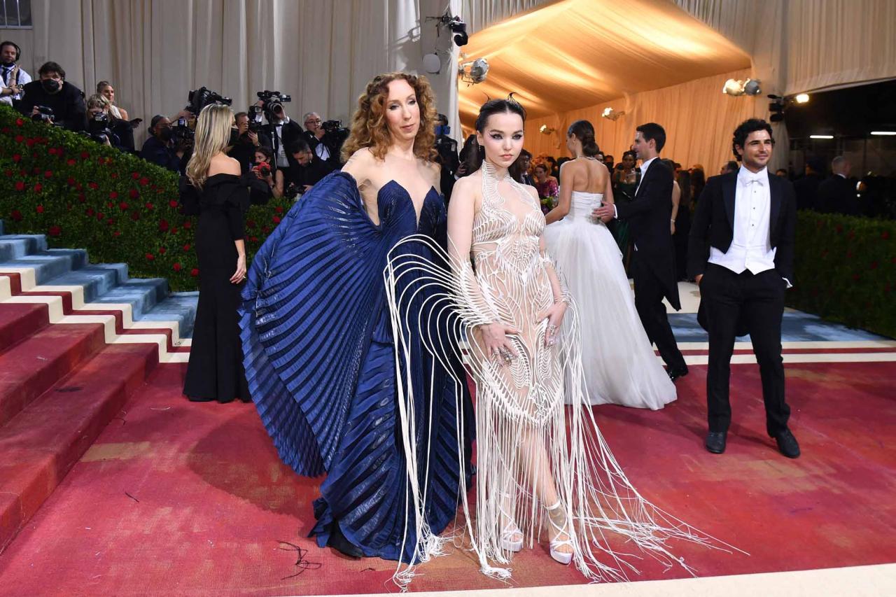 US actress Dove Cameron (R) and Dutch designer Iris Van Herpen arrives for the 2022 Met Gala at the Metropolitan Museum of Art on May 2, 2022, in New York. - The Gala raises money for the Metropolitan Museum of Art's Costume Institute. The Gala's 2022 theme is "In America: An Anthology of Fashion". (Photo by ANGELA  WEISS / AFP)