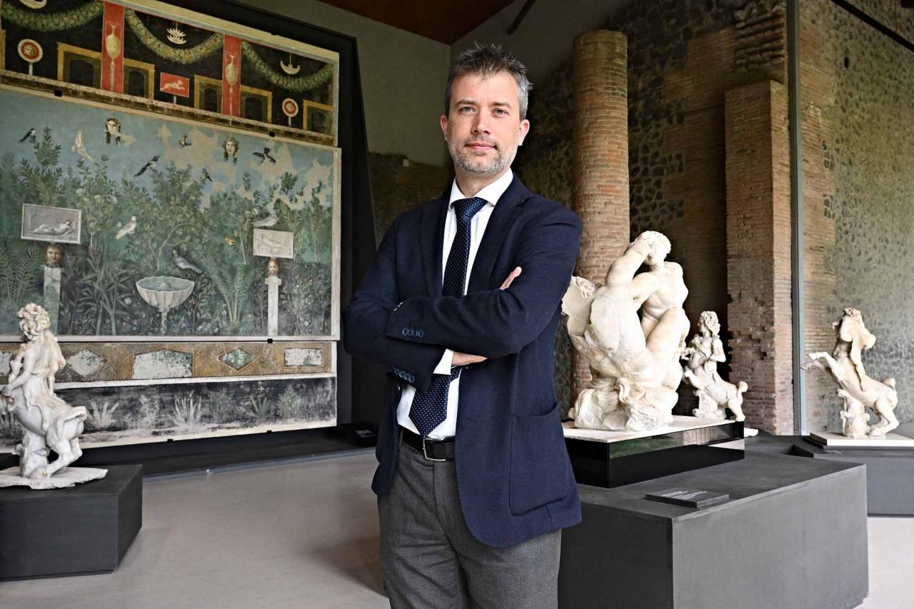 Pompeii's site director Gabriel Zuchtriegel, poses during a new exhibition in Pompeii's site entitled "Art and sensuality in the houses of Pompeii" on art and sexuality in the ancient city, where sculptures and paintings of breasts and buttocks abounded, on April 28, 2022. - Raunchy scenes may redden faces at a new exhibition in Pompeii on art and sexuality in the ancient Roman city, where sculptures and paintings of breasts and buttocks abounded. Archaeologists excavating the city, which was destroyed by the eruption of nearby Vesuvius in 79 AD, were initially startled to discover erotic images everywhere, from garden statues to ceiling frescos. (Photo by Andreas SOLARO / AFP)
