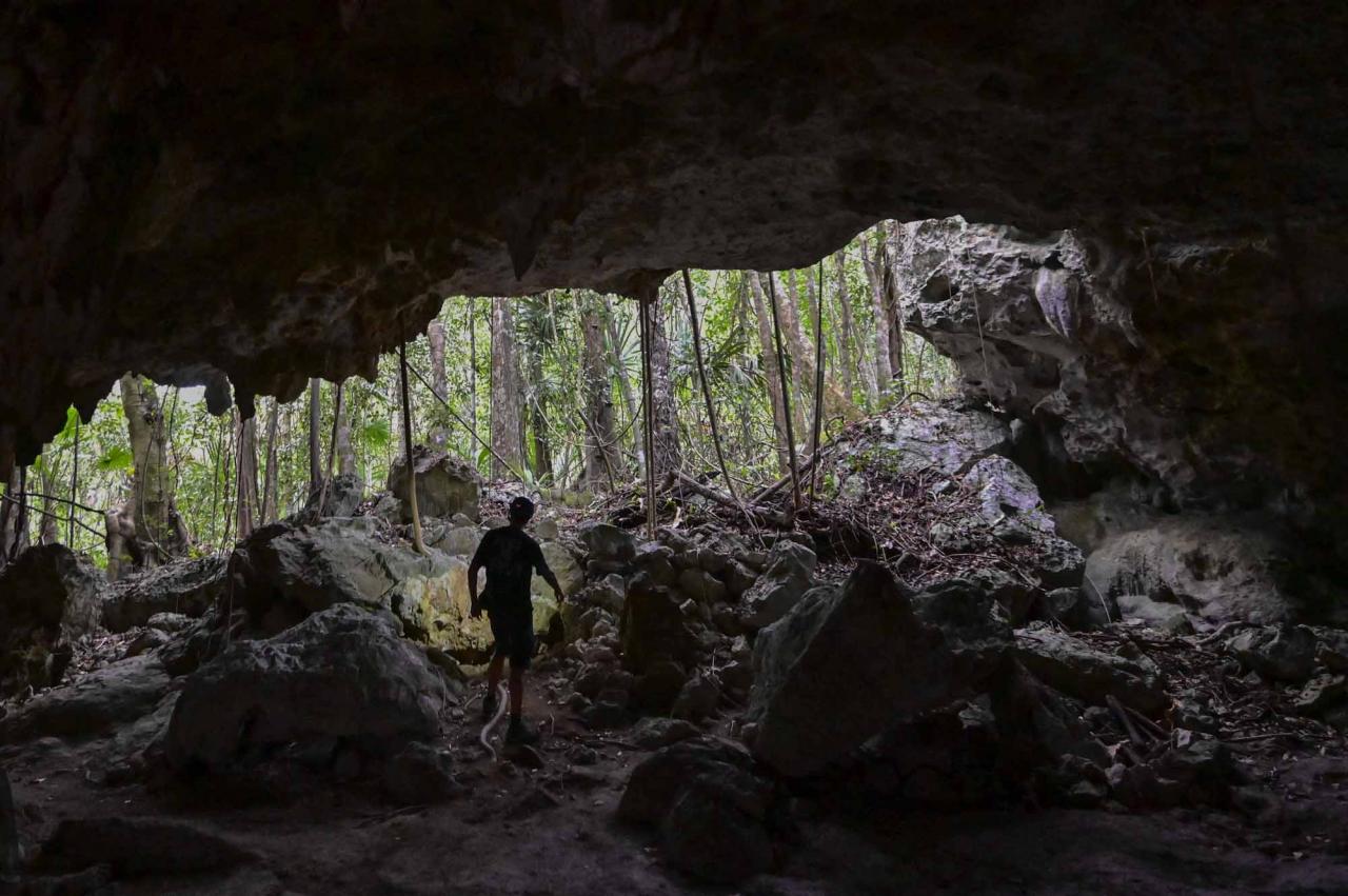 Spanish speleologist and diver Vicente Fito, 48, explores the cave system known as Garra de Jaguar (Jaguar's Claw), near the construction site of Section 5 South of the Mayan Train between the resorts of Playa del Carmen and Tulum which was halted by a district judge pending resolution of an injunction sought by scuba divers and environmentalists -- in the jungle in Playa del Carmen, Quintana Roo State, Mexico, on April 26, 2022. - A Mexican judge earlier this month suspended construction of part of President Andres Manuel Lopez Obrador's flagship tourist train project in the Yucatan peninsula due to a lack of environmental impact studies. The Mayan Train, a roughly 1,500-kilometre (950 mile) rail loop linking popular Caribbean beach resorts and archeological ruins, has met with opposition from environmentalists and indigenous communities. (Photo by Pedro PARDO / AFP)