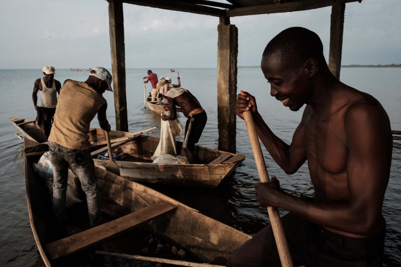Fishermen leave to fish at Lake Tanganyika in Bujumbura, Burundi, on March 16, 2022. - Burundi is classified as the poorest nation in the world in terms of GDP per capita, according to the World Bank.
But here too, as in other countries, young people, who make up the majority of Burundi's population, are increasingly connected.
Launched in 2021, the VisitBurundi initiative brings together around a dozen volunteers who organise trips for large groups of visitors, help to spruce up tourist destinations and, above all, broadcast Burundi's charms to the world.
The team is inspired by Dubai, where influencers thronged to beaches and bars even during the pandemic.
Bujumbura is not yet Dubai, but the prospects for tourism, domestic and international, are looking up. (Photo by Yasuyoshi Chiba / AFP)
