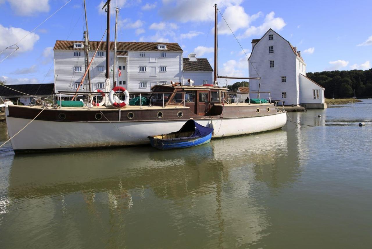 Historic boat and Tide Mill on the waterfront, River Deben, Woodbridge, Suffolk, England, UK. (Photo by: Geography Photos/Universal Images Group via Getty Images)