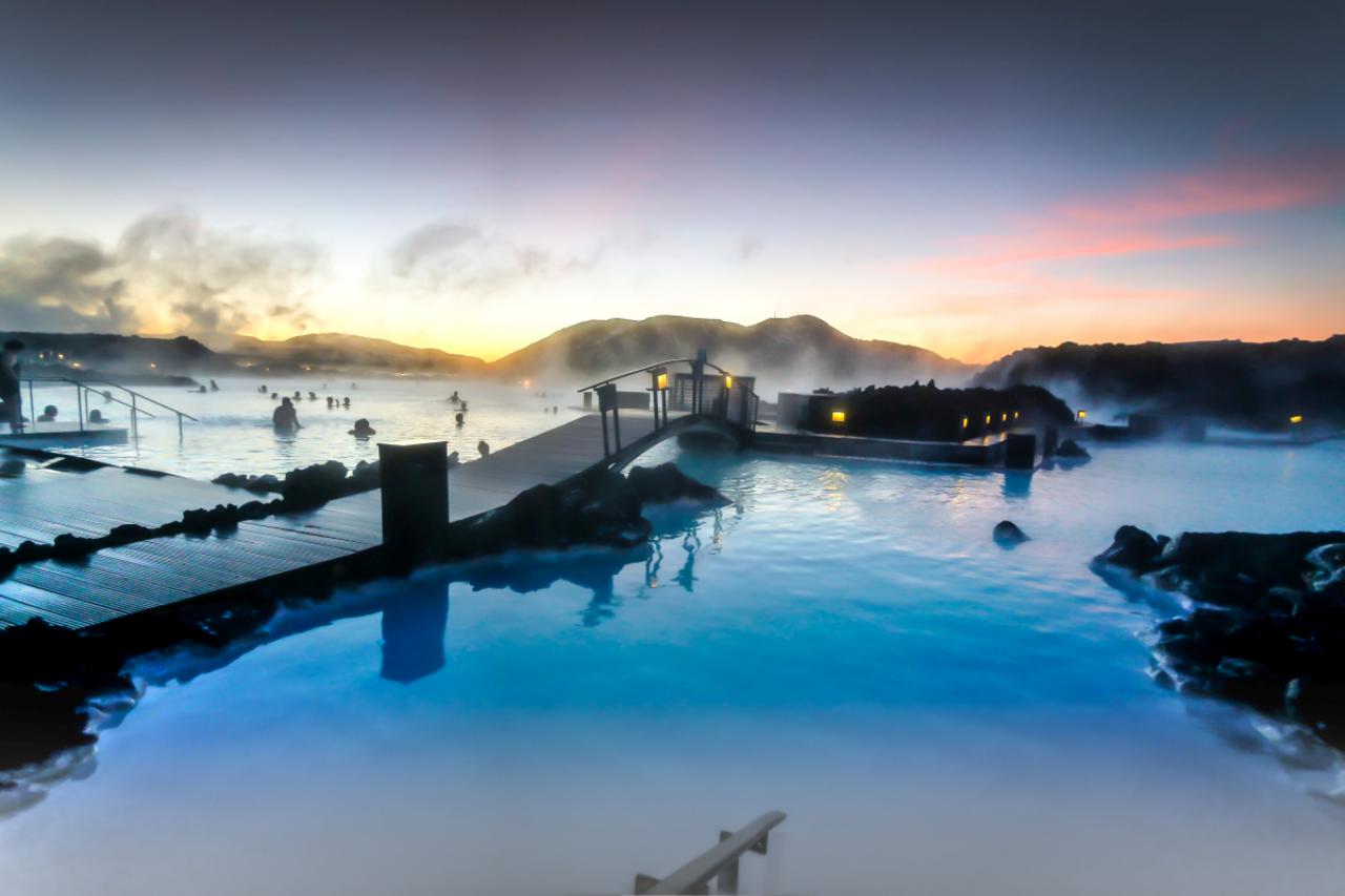 The sun was rising at the blue lagoon and it was a delight to swim in the warm baths with the outside temperature around zero degrees created a slight mist in the air as the cold air made contact to the warm water.