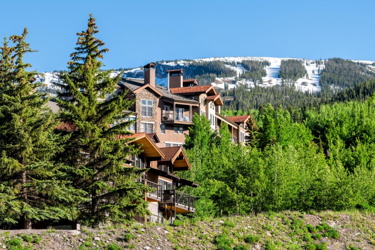 Aspen Snowmass village town houses on hill in Colorado dummer with snow mountain