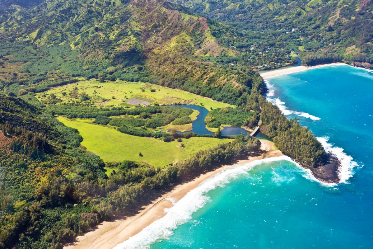 Aerial view from helicopter of the beautiful and dramatic scenic landscape of Lumahai Beach and Wainiha Bay of Kauai, Hawaii, USA. The beautiful beach is a popular tourist destination located on the north side of the island of Kauai.