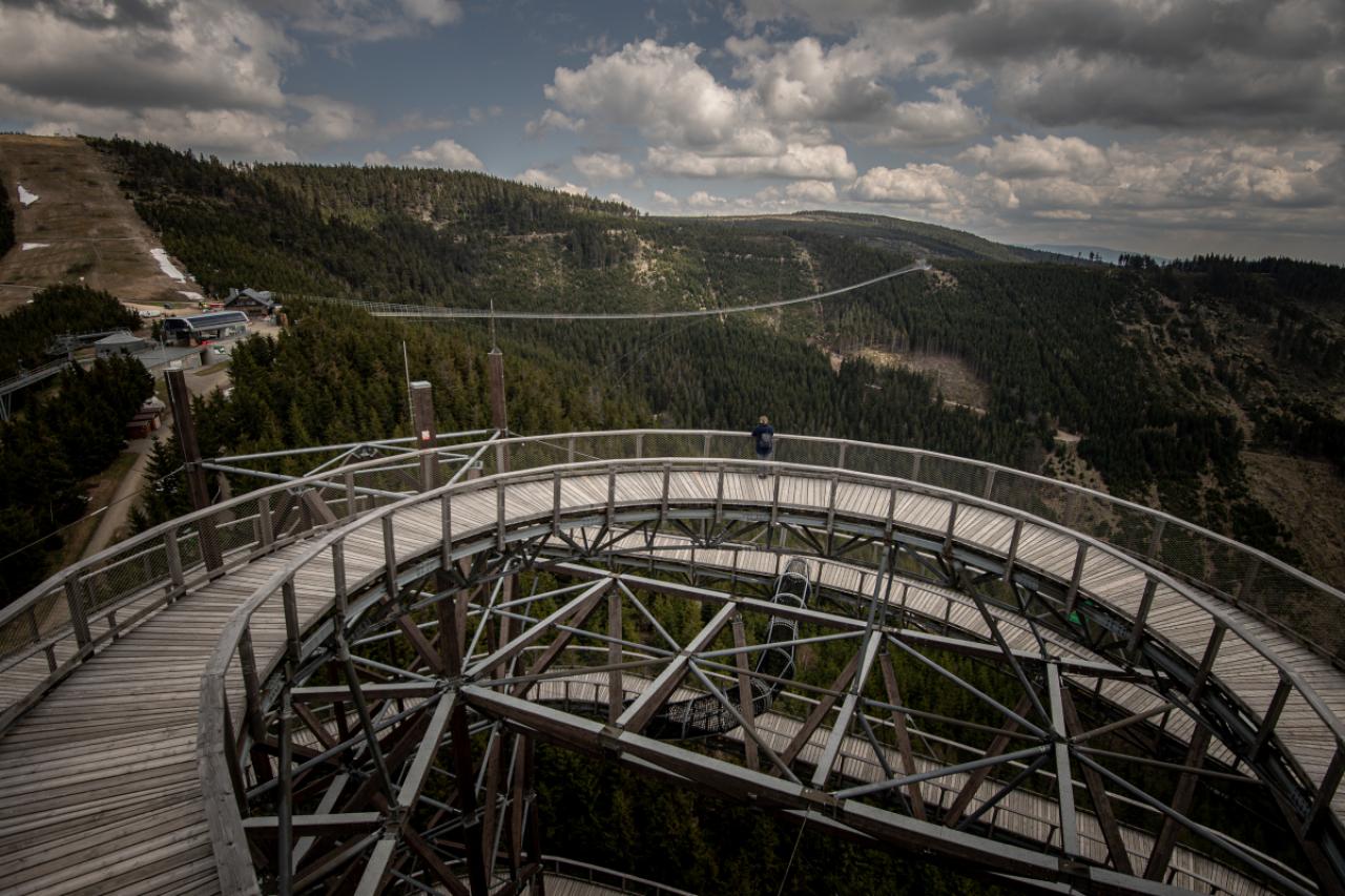 DOLNI MORAVA, CZECH REPUBLIC - MAY 9: A visitor looks at the longest suspension pedestrian bridge in the world Sky Bridge 721 is seen in Dolni Morava, Czech Republic on May 9, 2022. Sky Bridge 721, the longest pedestrian bridge in the world with a length of 721 meters and an elevation of 95 meters above the ground, is located in the Pardubice region (a break between the Eagle Mountains and the Jesenice). (Photo by Lukas Kabon/Anadolu Agency via Getty Images)