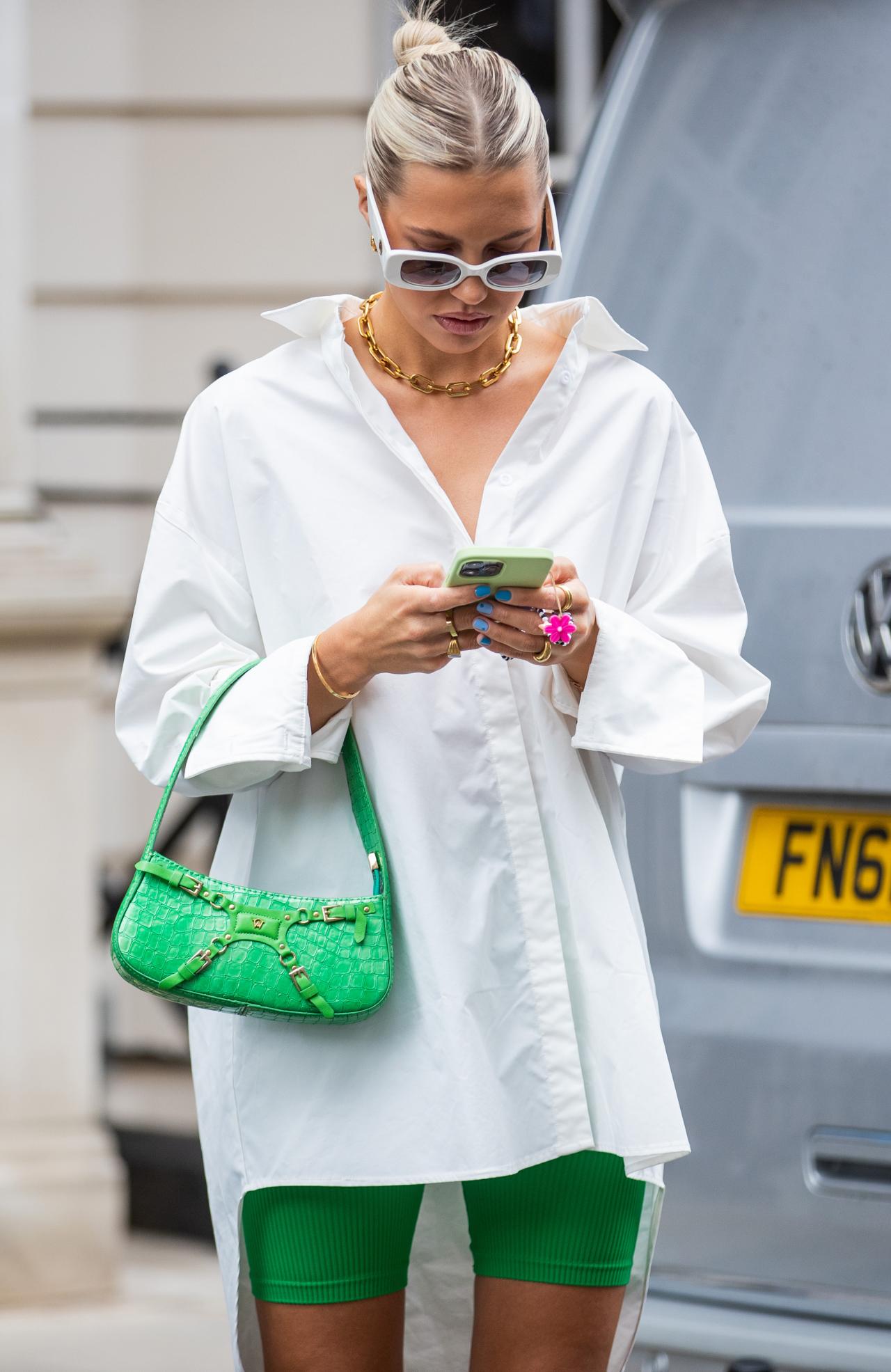 LONDON, ENGLAND - SEPTEMBER 20: Caroline Ebo is seen wearing white button shirt, green bag, shorts outside Paul & Joe during London Fashion Week September 2021 on September 20, 2021 in London, England. (Photo by Christian Vierig/Getty Images)