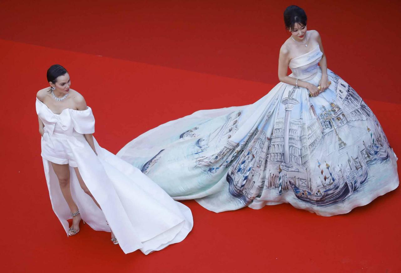 The 75th Cannes Film Festival - Opening ceremony and screening of the film "Coupez" (Final Cut) Out of competition - Red Carpet arrivals - Cannes, France, May 17, 2022. Emilia Schuele and a guest and arrive.