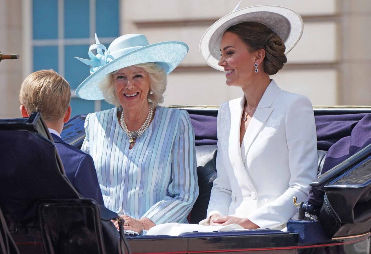 Britain's Prince George of Cambridge (L), Britain's Camilla, Duchess of Cornwall (C) and Britain's Catherine, Duchess of Cambridge (R) leave Buckingham Palace, on their way to the Queen's Birthday Parade, the Trooping the Colour, as part of Queen Elizabeth II's platinum jubilee celebrations, on June 2, 2022, in London. - Huge crowds converged on central London in bright sunshine on Thursday for the start of four days of public events to mark Queen Elizabeth II's historic Platinum Jubilee, in what could be the last major public event of her long reign. (Photo by Jonathan Brady / POOL / AFP)