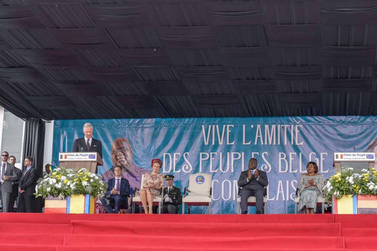 Belgium's King Philippe (L) addresses dignitaries and members of the public at the National Assembly in Kinshasa on June 8, 2022 as Belgium Prime Minister Alexandre De Croo (2nd L) Belgium Queen Mathilde (3rd L) and Democratic Republic of the Congo President Felix Tshisekedi (R) look on. - Belgium's King Philippe, in a historic visit to DR Congo, said on June 8, 2022 that his country's rule over the vast central African country had inflicted pain and humiliation through a mixture of "paternalism, discrimination and racism."
In a speech outside the Democratic Republic of Congo's parliament, Philippe amplified remorse he first voiced two years ago over Belgium's brutal colonial rule -- an era that historians say saw millions die. (Photo by Arsene Mpiana / AFP)