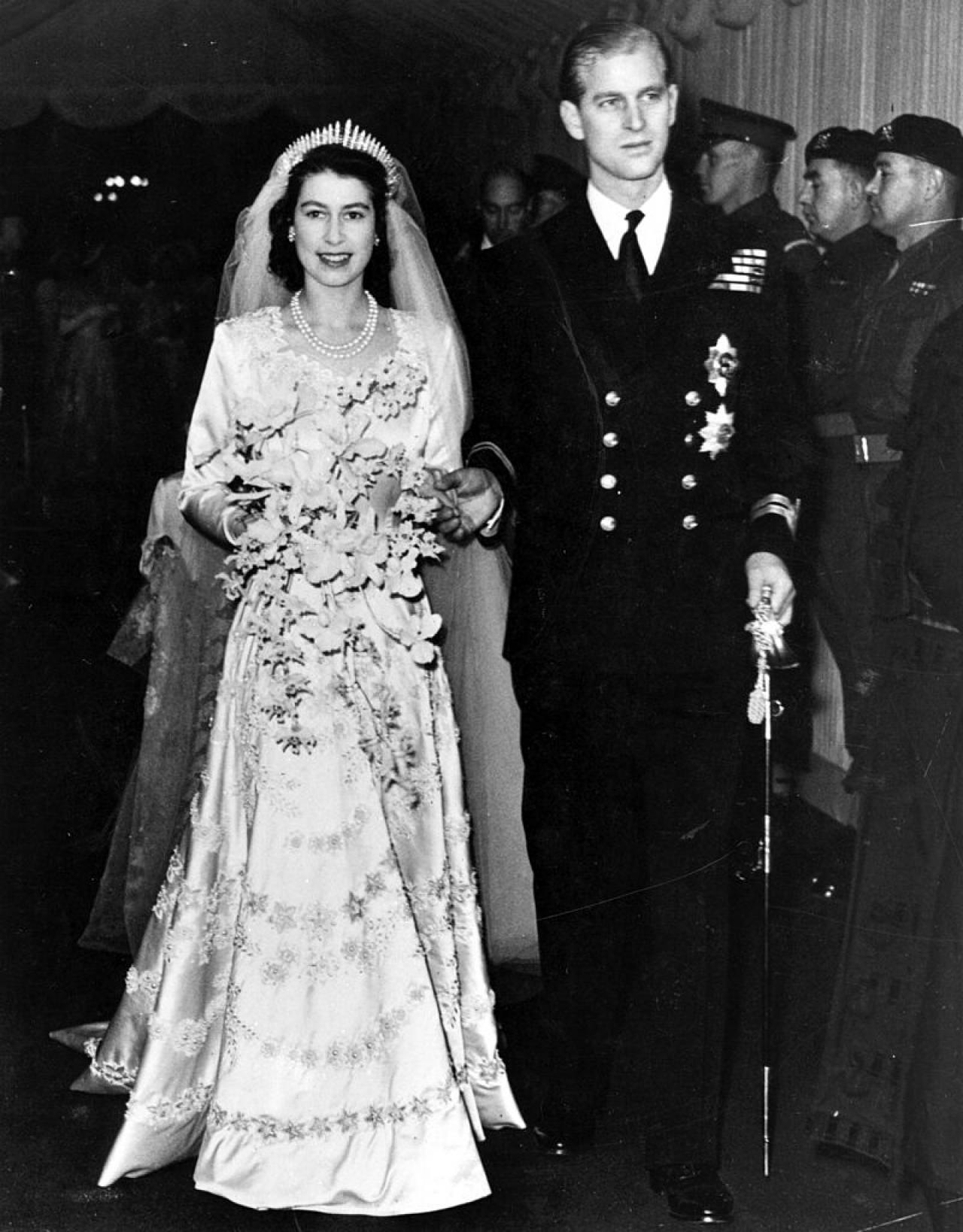 Queen Elizabeth II, as Princess Elizabeth, and her husband the Duke of Edinburgh, styled Prince Philip in 1957, on their wedding day. She became queen on her father King George VI's death in 1952.   (Photo by Hulton Archive/Getty Images)