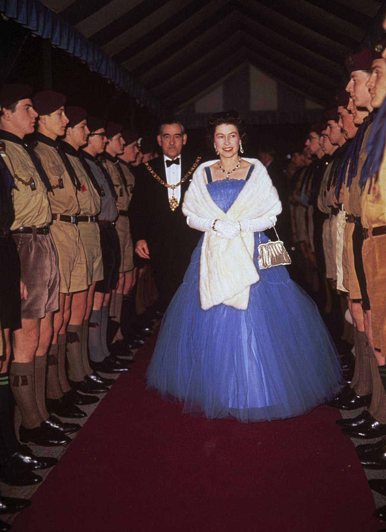 Queen Elizabeth II inspects boy scouts at a performance of the scouting revue, 'The Gang Show', 1967. (Photo by Hulton Archive/Getty Images)