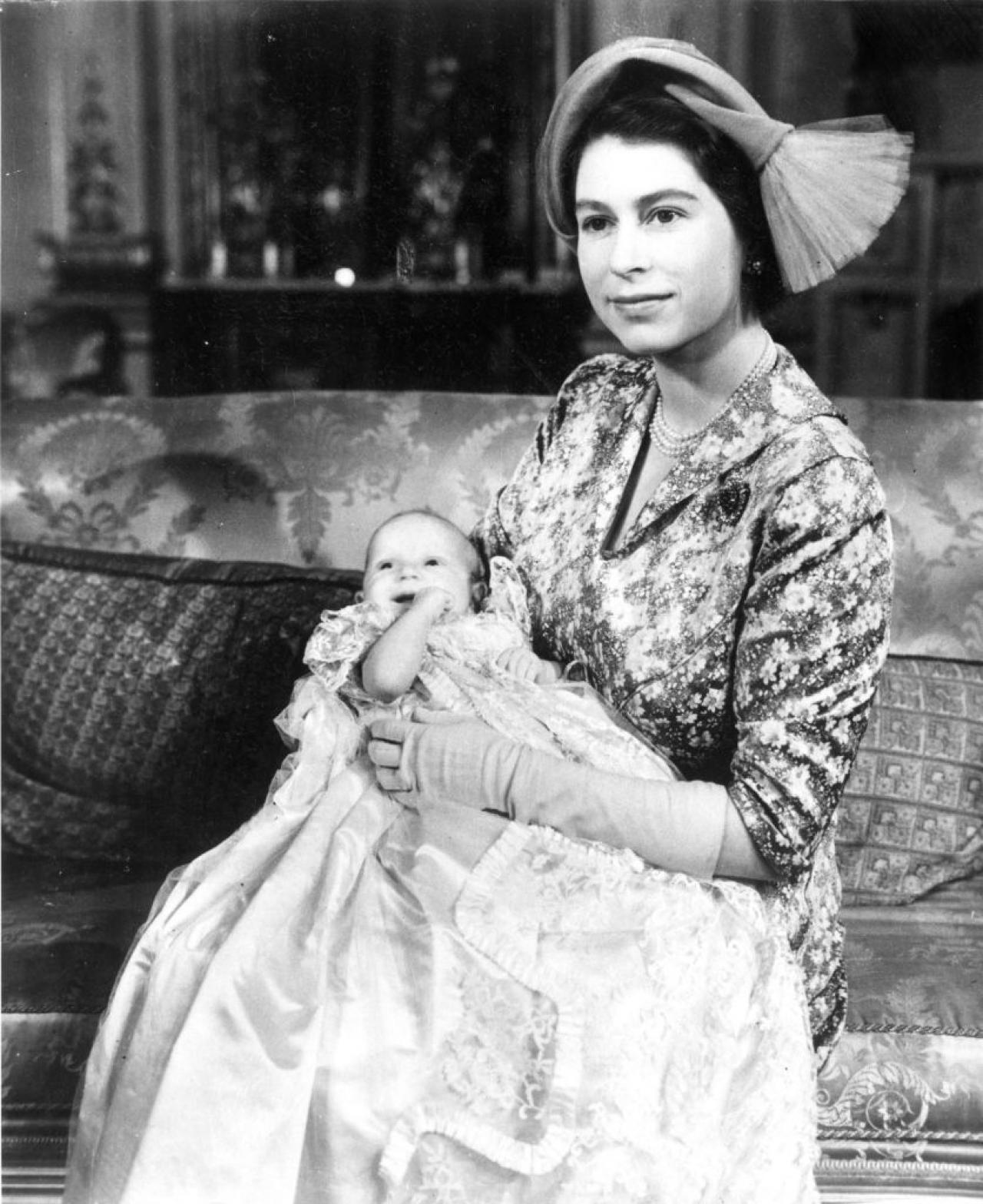21st October 1950:  Princess Elizabeth with her baby daughter Princess Anne who is wearing the Royal christening robe made of Honiton lace.  (Photo by Central Press/Hulton Archive/Getty Images)
