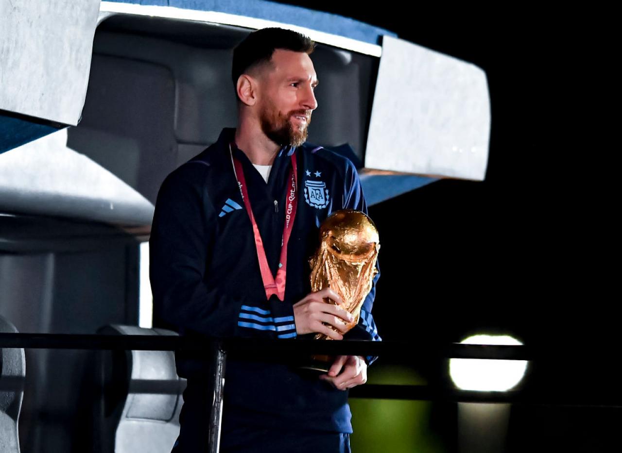 BUENOS AIRES, ARGENTINA - DECEMBER 20: Lionel Messi holds the FIFA World Cup during the arrival of the Argentina men's national football team after winning the FIFA World Cup Qatar 2022 on December 20, 2022 in Buenos Aires, Argentina. (Photo by Marcelo Endelli/Getty Images)