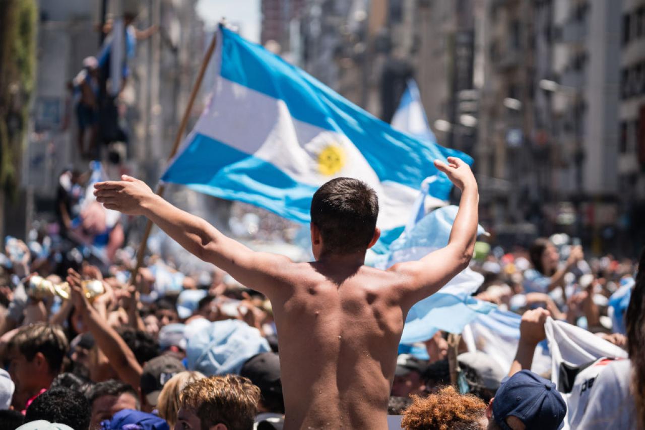 BUENOS AIRES - ARGENTINA, DECEMBER 20: Argentinians celebrating their nationâs third World Cup victory, in the capital Buenos Aires, Argentina on December 20, 2022. On Sunday, Messi-led Argentina beat France 4-2 on penalties in Qatar to bag the nation's third FIFA World Cup title. The Argentine national team was expected to tour the streets of the city by bus, but the number of people in the streets exceeded expectations and made it impossible for the team to arrive, which had to be evacuated by helicopter without completing the tour. (Photo by Diego Radames/Anadolu Agency via Getty Images)