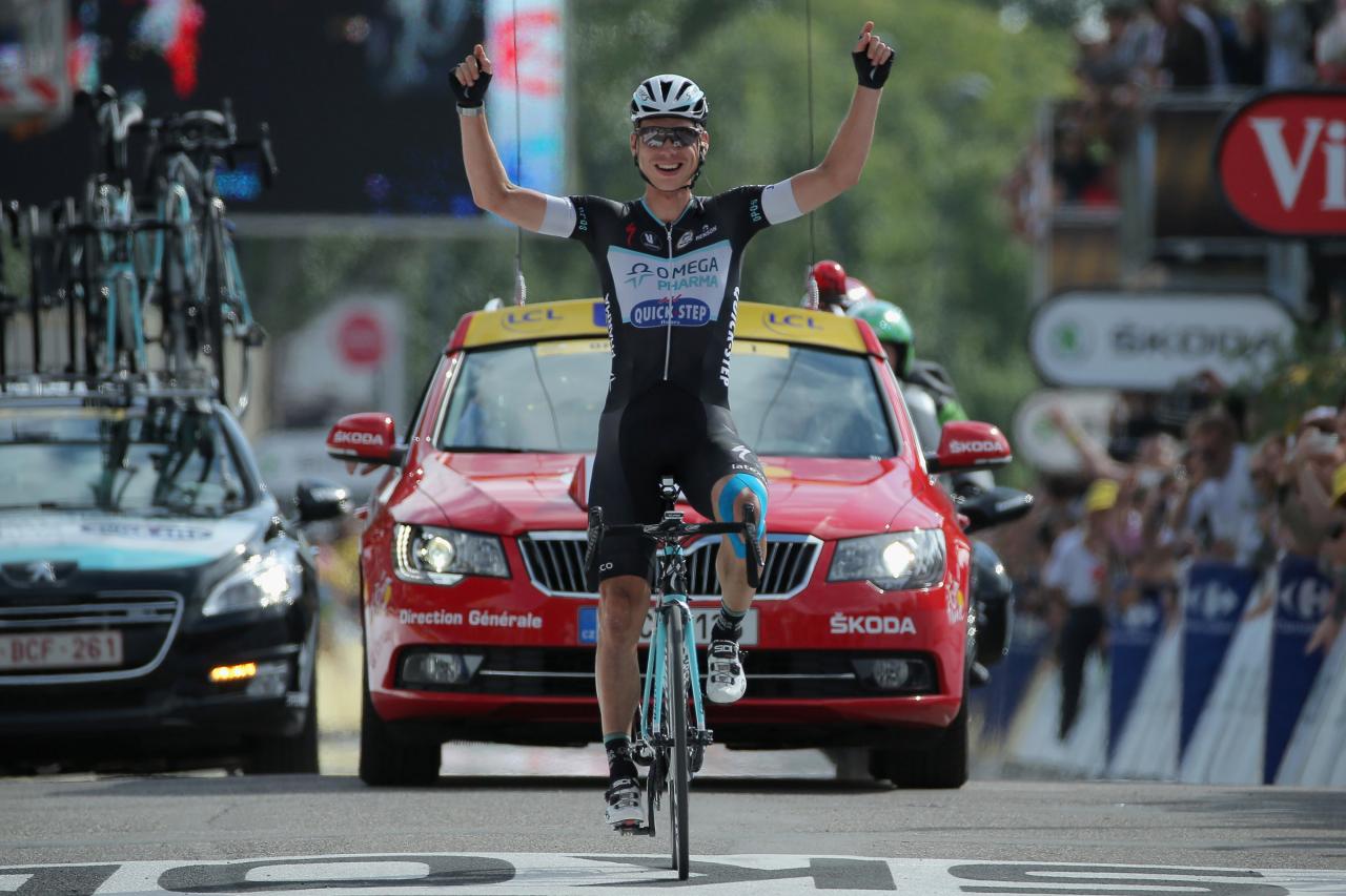 MULHOUSE, FRANCE - JULY 13:  Tony Martin of Germany and the Omega Pharma - Quick-Step Cycling Team celebrates as he crosses the finish line to win stage nine of the 2014 Le Tour de France from Gerardmer to Mulhouse on July 13, 2014 in Mulhouse, France.  (Photo by Doug Pensinger/Getty Images)
