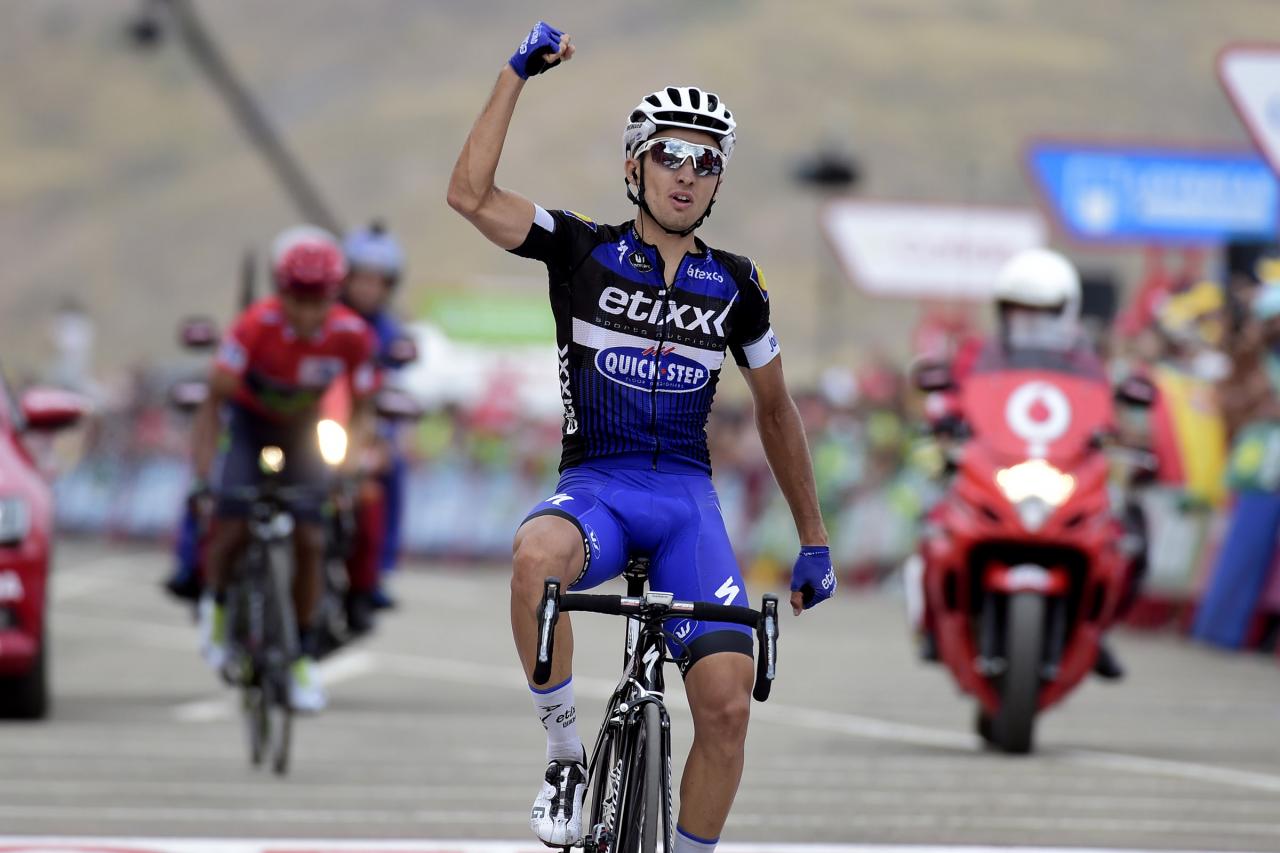 Etixx-Quick Step cyclist Gianluca Brambilla celebrates winning as he crosses the finish line ahead of Movistar's Colombian cyclist Nairo Quintana during the 15th stage of the 71st edition of "La Vuelta" Tour of Spain, a 120km route Sabinanigo to Formigal, on September 4, 2016. / AFP / JOSE JORDAN (Photo credit should read JOSE JORDAN/AFP via Getty Images)