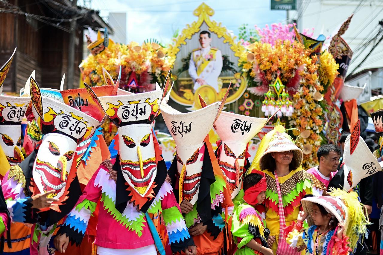 Participants wearing ghost masks and colorful costumes take part in a parade during the annual Phi Ta Khon carnival or ghost festival in Dan Sai district in northeastern Thailands Loei Province on June 24, 2023. (Photo by MANAN VATSYAYANA / AFP)