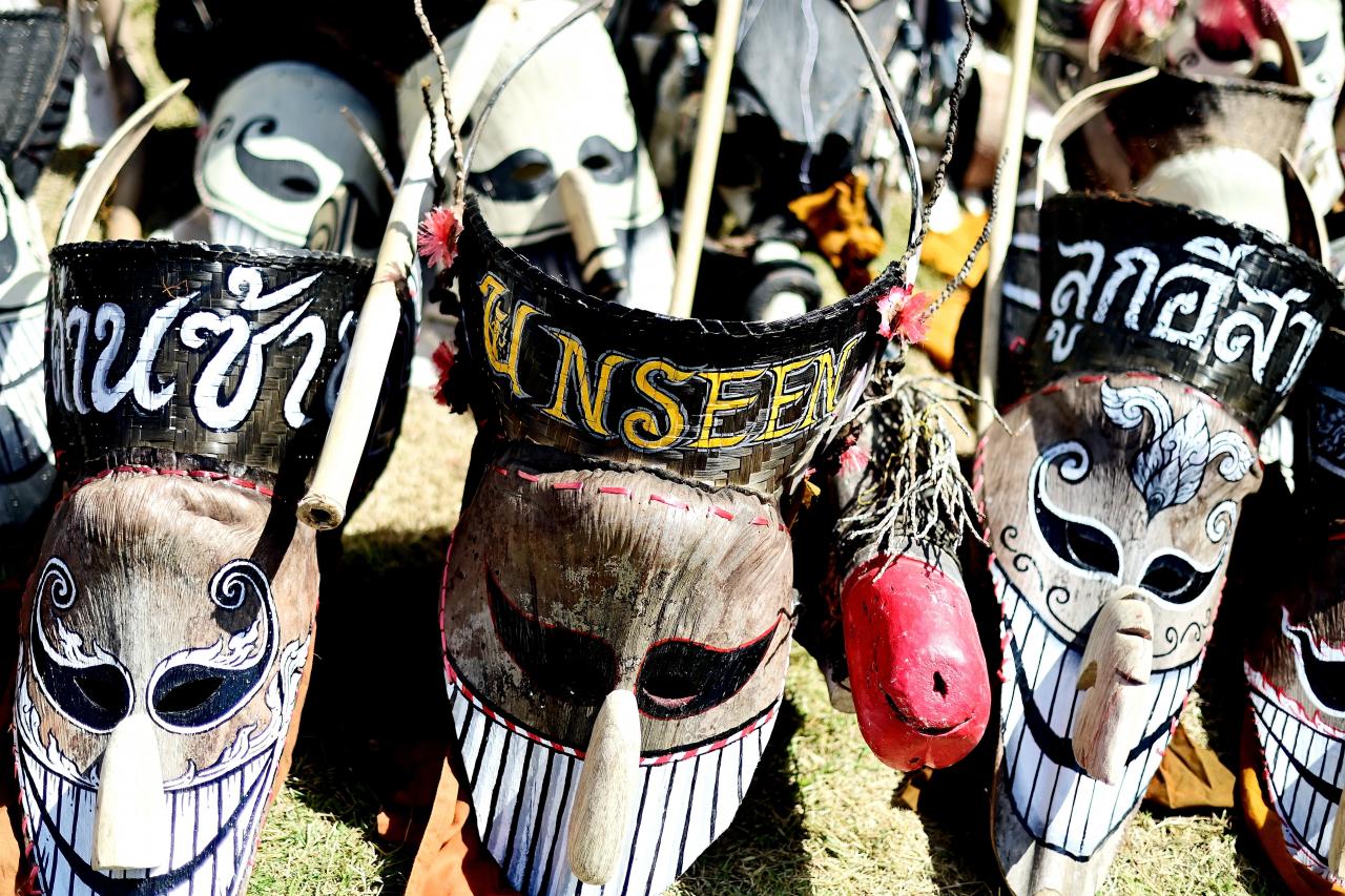 Elaborate long-nosed ghost masks are seen on the ground ahead of a parade during the annual Phi Ta Khon carnival or ghost festival in Dan Sai district in northeastern Thailands Loei Province on June 24, 2023. (Photo by MANAN VATSYAYANA / AFP)
