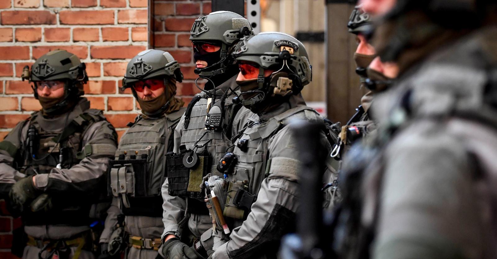 Military personnel in tactical gear